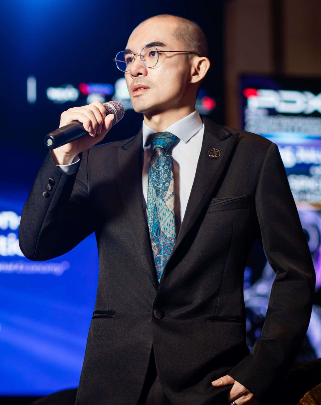Ts. Lukas J. Tan — confident portrait on the PDX2026 stage